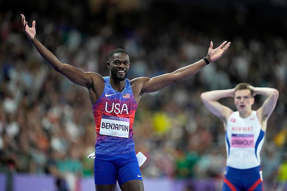 | Photo: AP/Ashley Landis : Gold medalist Rai Benjamin, of the United States, celebrates after men's 400 meters hurdles final 